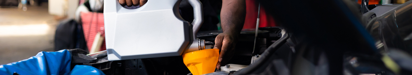 Changing the oil in a car.