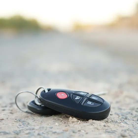 Car key laying on road