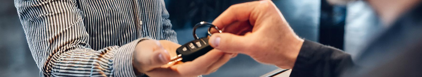 Handing car keys to a customer