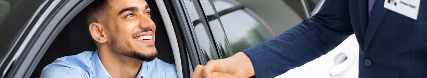 Man shaking hand and smiling