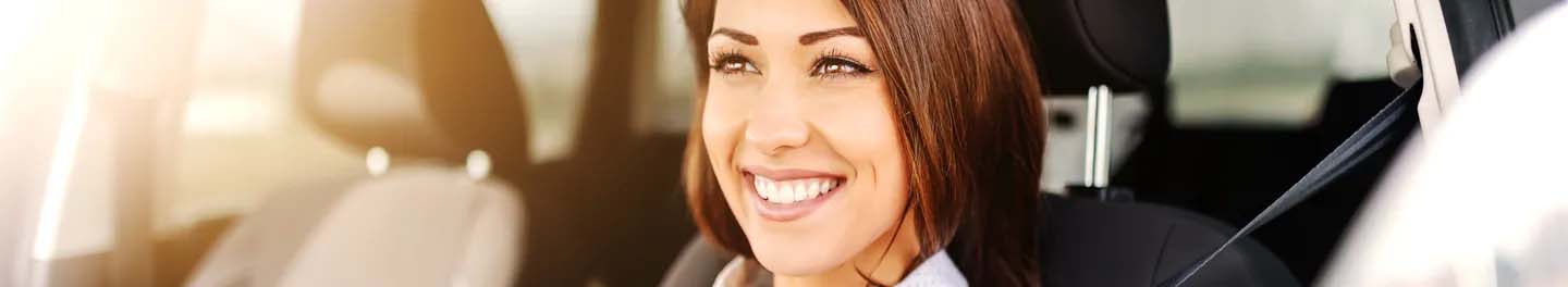 Woman smiling in car