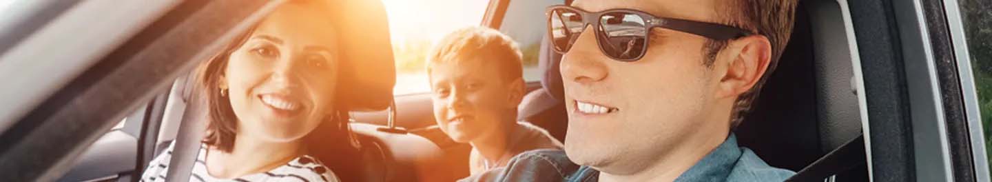 Man with sunglasses driving car
