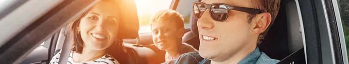 Man with sunglasses driving car