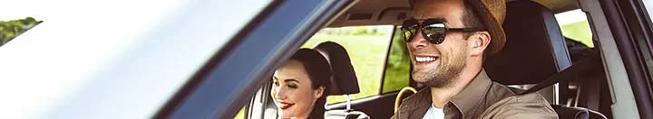 Man and woman driving car