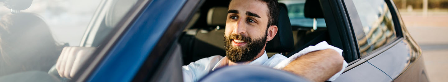 Man in car with window down
