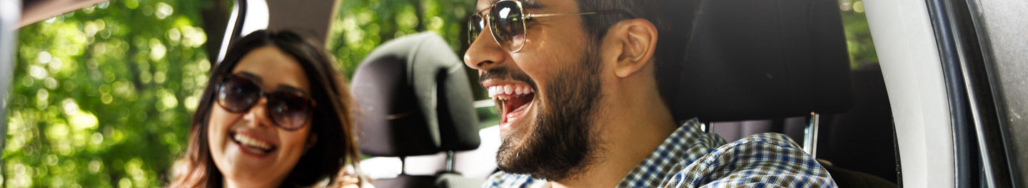 Couple laughing in car