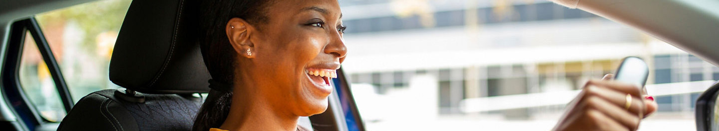 Woman smiling in car