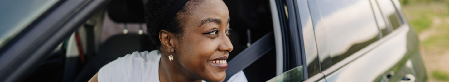 Woman in car looking out window