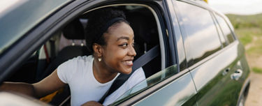 Woman in car looking out window