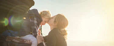 Woman embracing child