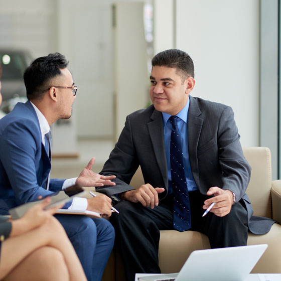 Two men talking during business meeting