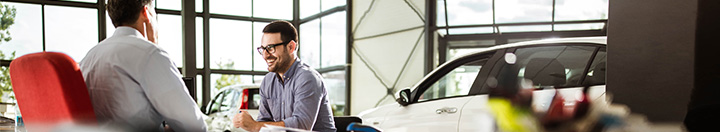 F&I managers in meeting at dealership