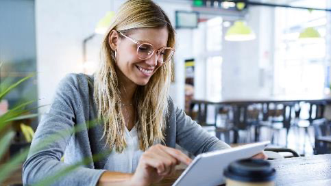 Woman on tablet smiling