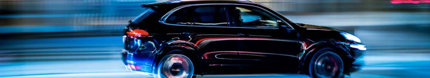 SUV driving at night