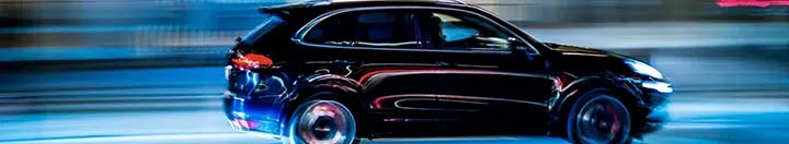 SUV driving at night