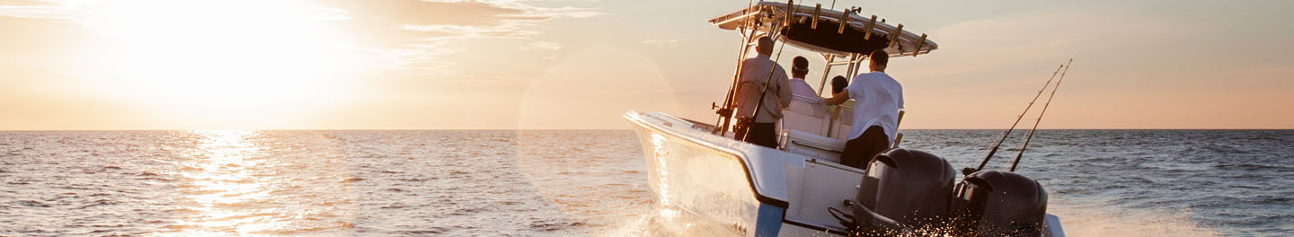 Boat on water during sunset