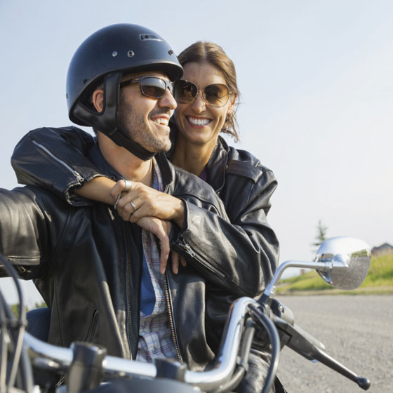 Man and woman on motorcycle