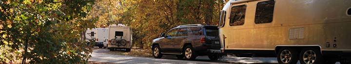 SUV pulling silver travel trailer