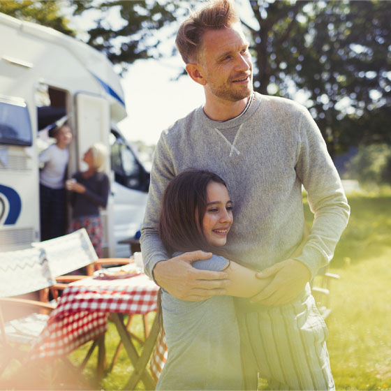 Father and daughter with RV