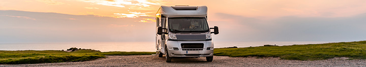 Children by lake and RV