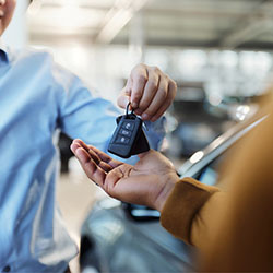 Getting keys to new car at dealership