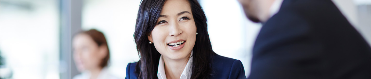 Woman smiling at meeting